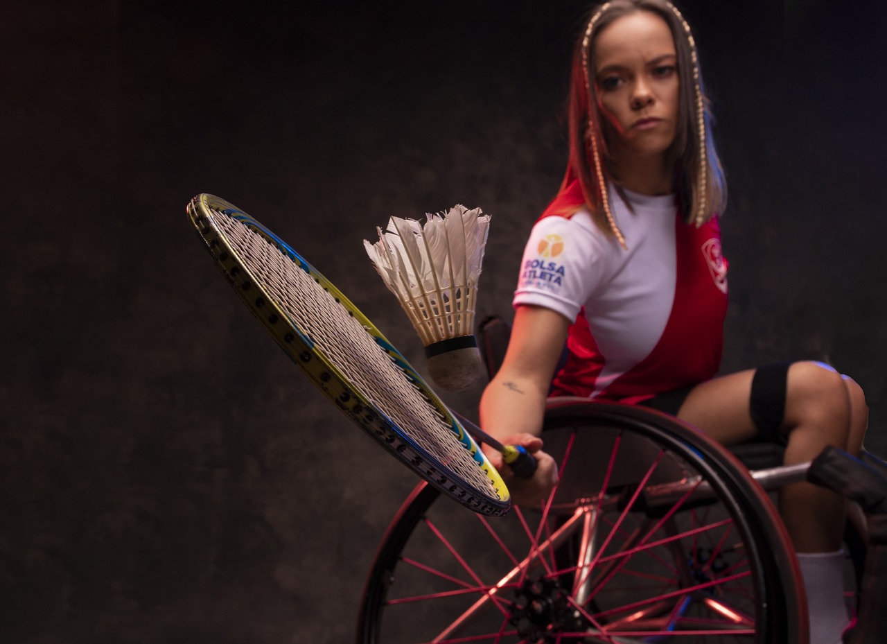 Girl in wheelchair playing badmitton